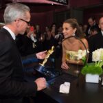 A man holding an award